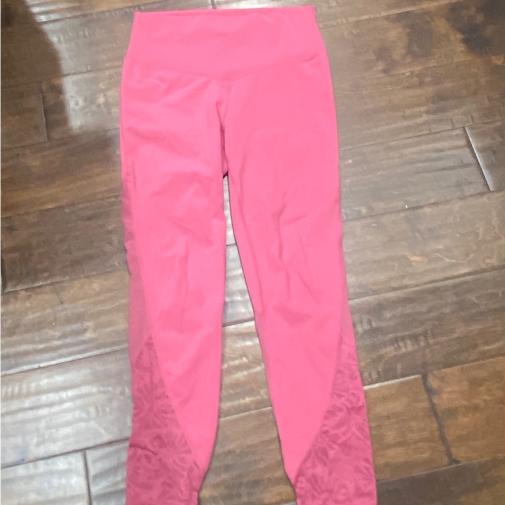 Size medium Fabletics leggings with lace mesh panels.